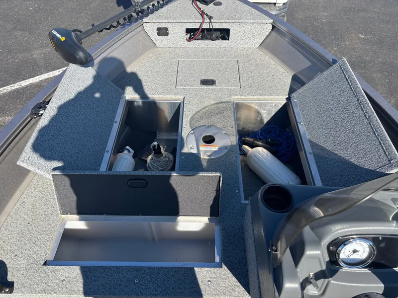 Slide: The Image of 2021 Crestliner 1650 Discovery SC boat interior with open storage compartments. - 4