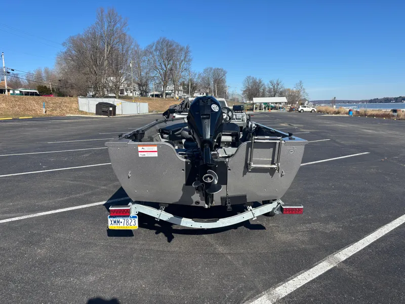 Slide: The Image of 2021 Crestliner 1650 Discovery SC boat on trailer in parking lot. - 7