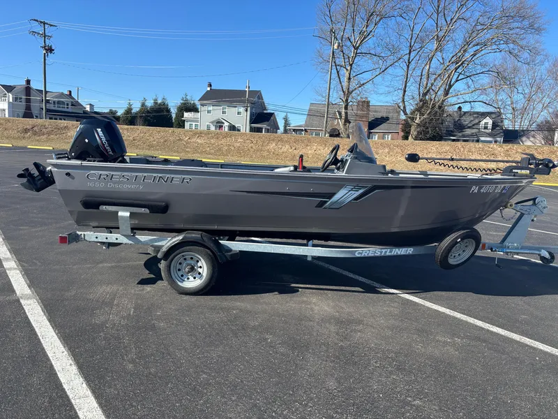Slide: The Image of 2021 Crestliner 1650 Discovery SC boat on trailer in parking lot. - 8