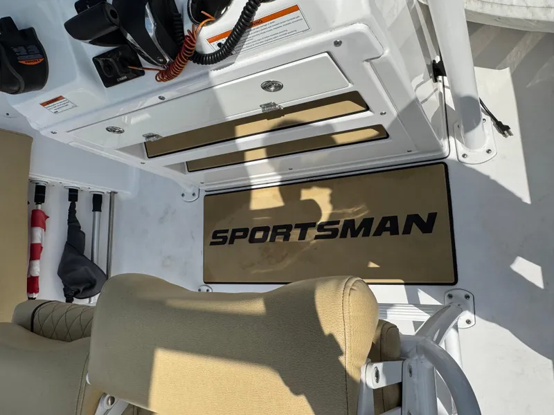 Slide: The Image of 2022 Sportsman Open 212 Center Console interior with branded mat and seating. - 11