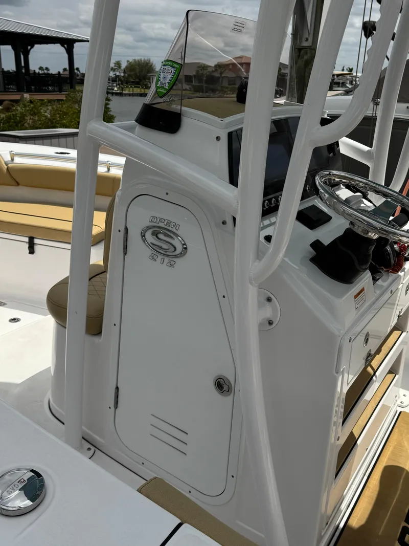 Slide: The Image of 2022 Sportsman Open 212 Center Console boat interior with steering wheel and seating. - 12