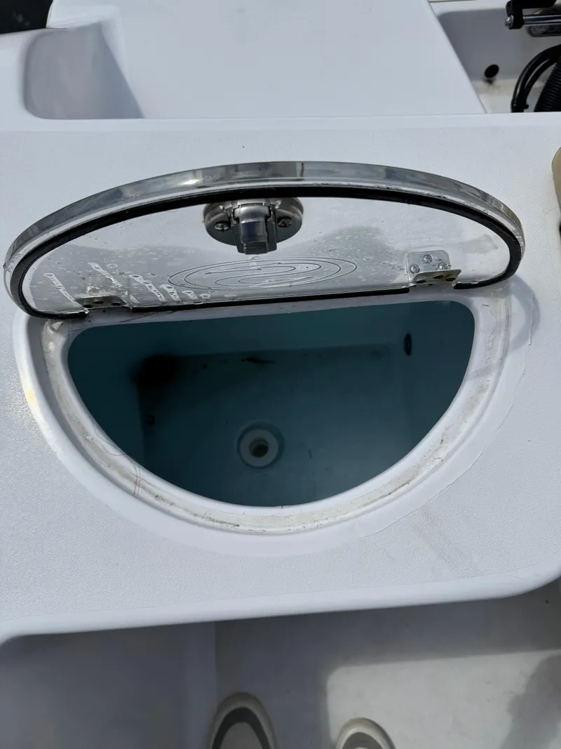 Slide: The Image of Open hatch on 2022 Sportsman Open 212 Center Console boat. - 19