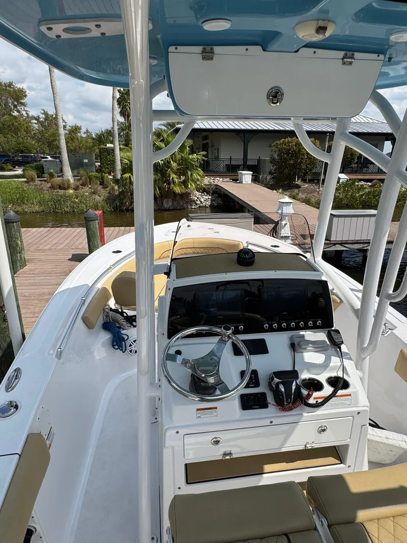 Slide: The Image of 2022 Sportsman Open 212 Center Console boat, featuring a sleek helm and spacious deck. - 3
