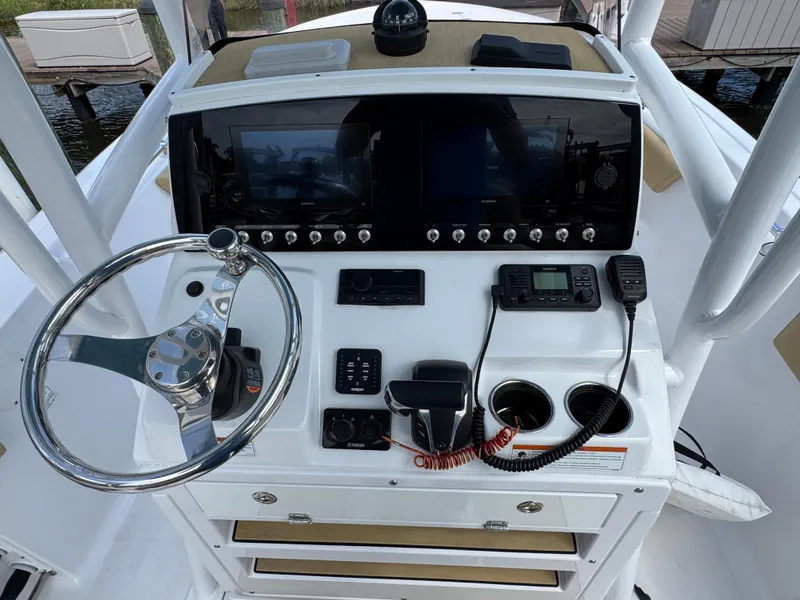 Slide: The Image of 2022 Sportsman Open 212 Center Console dashboard with steering wheel and navigation controls. - 4