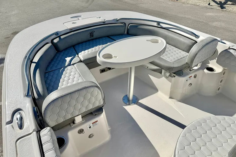 Slide: The Image of 2025 Carolina Skiff 21 Ultra Elite boat interior with open storage compartments and seating. - 13