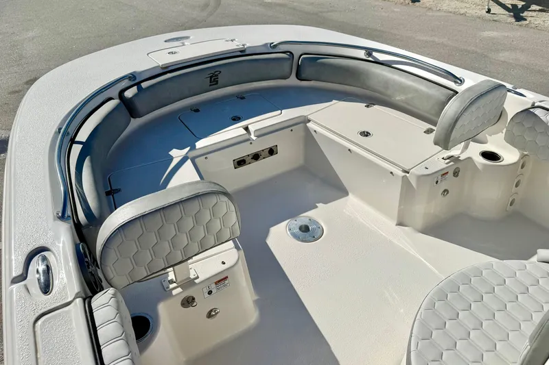 Slide: The Image of 2025 Carolina Skiff 21 Ultra Elite boat seating with hexagonal pattern upholstery. - 14