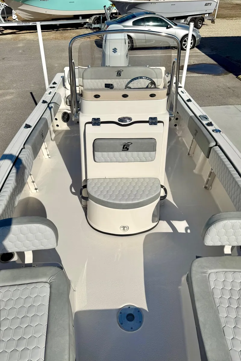 Slide: The Image of 2025 Carolina Skiff 21 Ultra Elite boat interior with safety equipment and seating. - 16