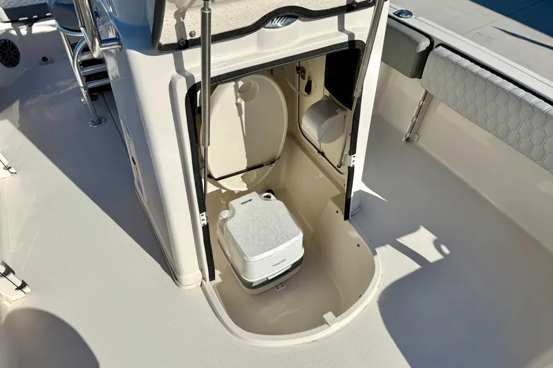 Slide: The Image of 2025 Carolina Skiff 21 Ultra Elite boat interior with steering console and seating. - 19