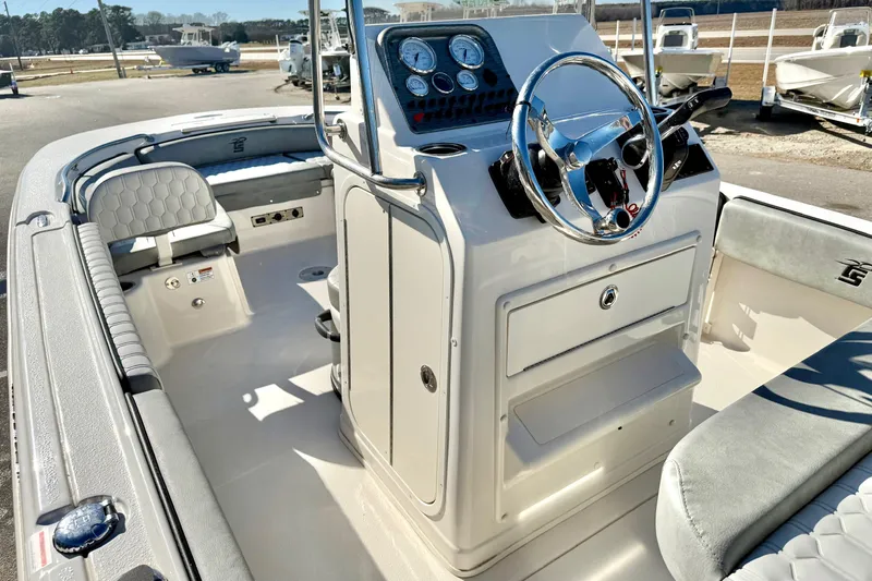Slide: The Image of Storage compartment on 2025 Carolina Skiff 21 Ultra Elite boat, featuring a secure latch. - 21