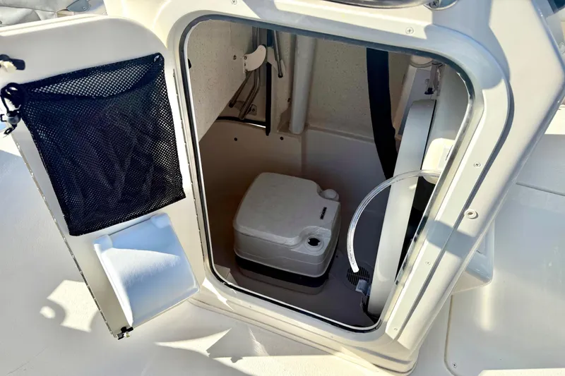 Slide: The Image of 2025 Carolina Skiff 21 Ultra Elite boat console with sleek design and sturdy metal supports. - 22