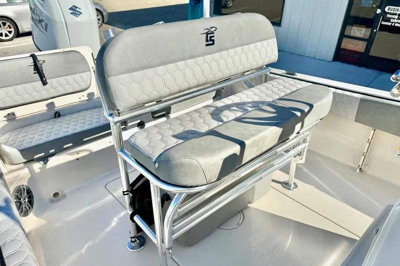 Slide: The Image of 2025 Carolina Skiff 21 Ultra Elite boat compartment with wiring and open hatch. - 23