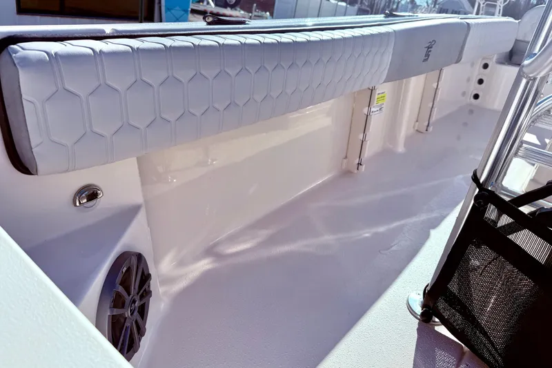 Slide: The Image of 2025 Carolina Skiff 21 Ultra Elite boat seating with hexagonal pattern and cup holders. - 27