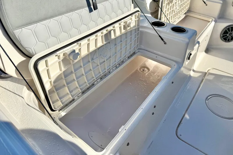 Slide: The Image of 2025 Carolina Skiff 21 Ultra Elite boat interior with hexagonal seat pattern and speaker. - 31