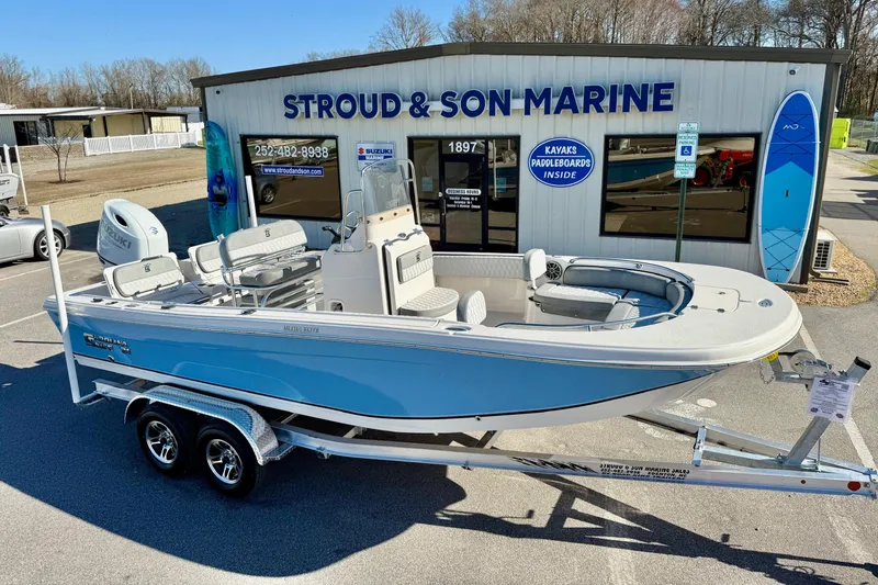 Slide: The Image of 2025 Carolina Skiff 21 Ultra Elite boat displayed outdoors, front view. - 8