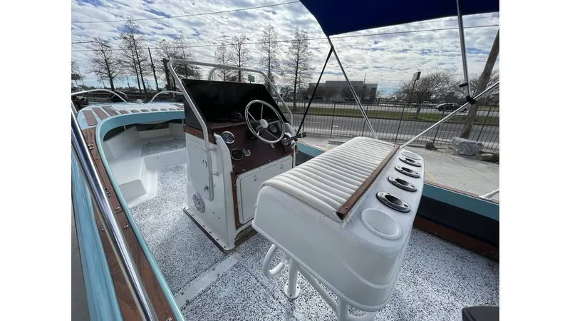 Slide: The Image of 1973 Boston Whaler 21 Outrage boat interior with steering console and seating. - 5