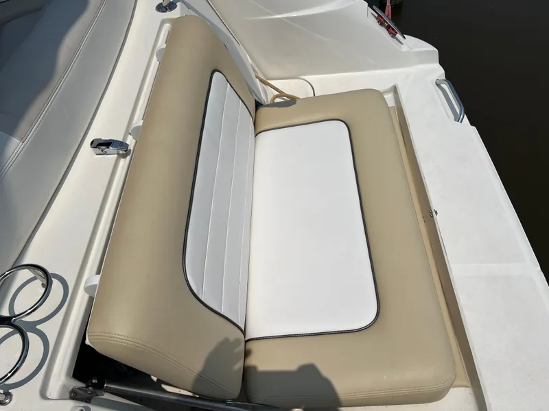 Slide: The Image of 2011 Sea Ray 330 Sundancer boat seat, beige and white upholstery. - 15