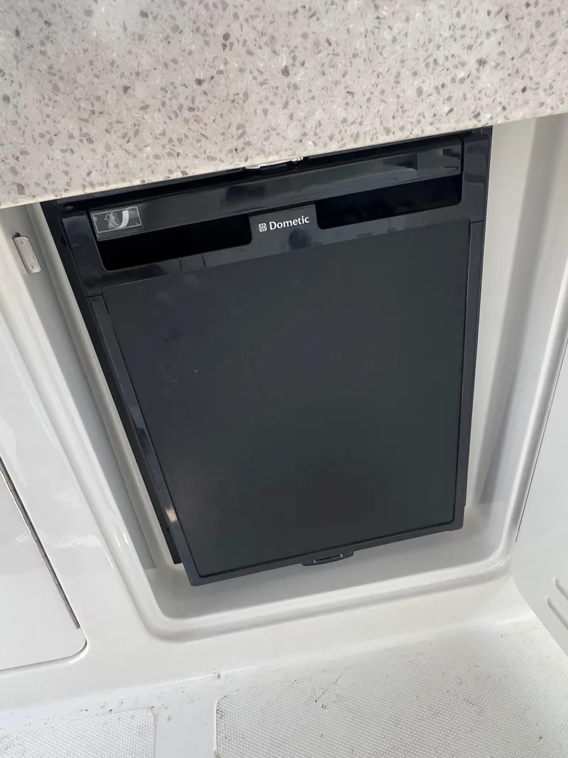 Slide: The Image of Compact Dometic refrigerator in 2011 Sea Ray 330 Sundancer boat interior. - 18