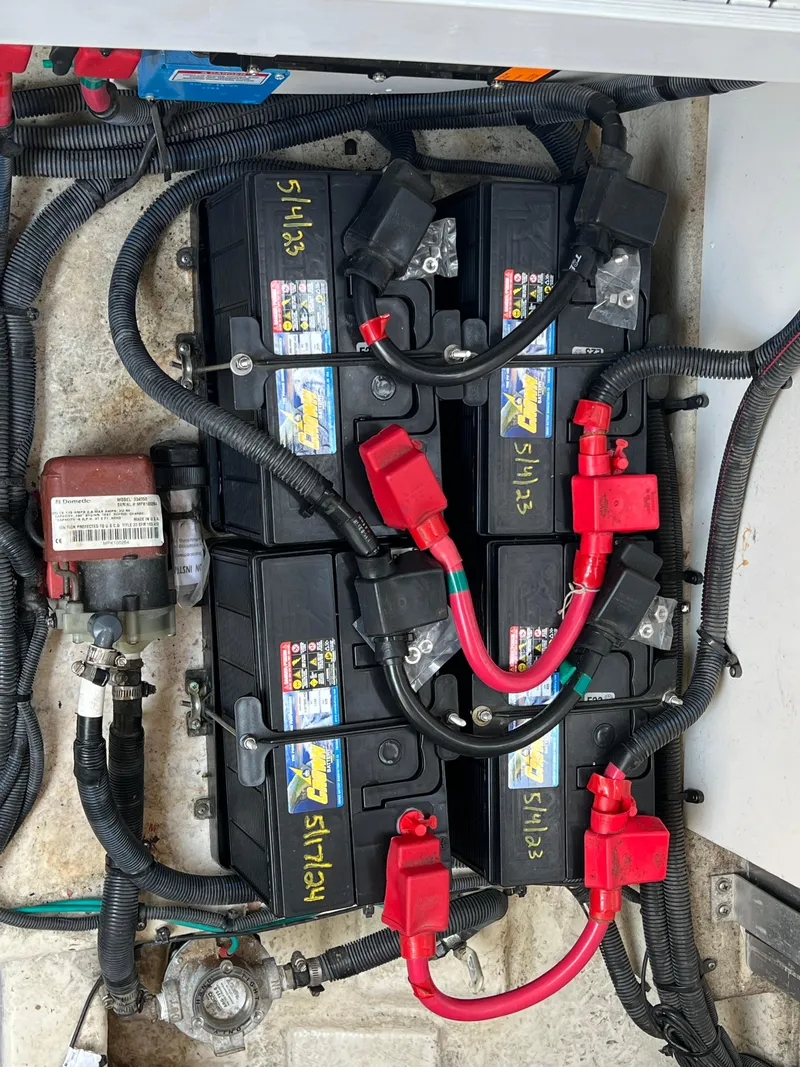 Slide: The Image of Batteries and wiring in a 2011 Sea Ray 330 Sundancer boat. - 35