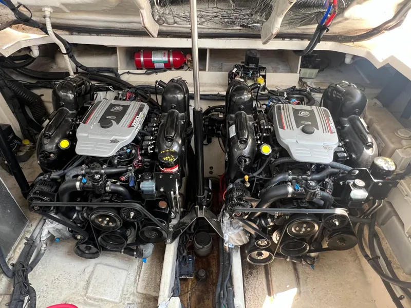 Slide: The Image of Twin engines in a 2011 Sea Ray 330 Sundancer boat engine compartment. - 37