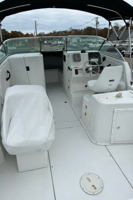 Slide: The Image of 2005 Seaswirl Striper 2301 Dual Console O/B boat interior with seating and steering wheel. - 12