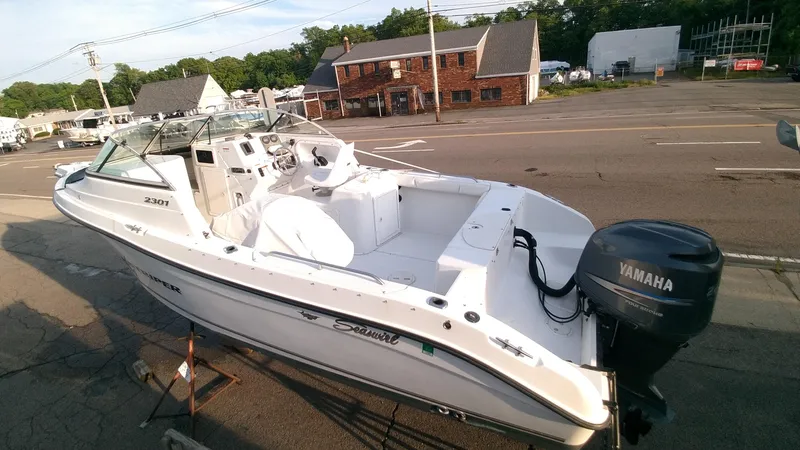 Slide: The Image of 2005 Seaswirl Striper 2301 Dual Console O/B boat with Yamaha outboard motor. - 3