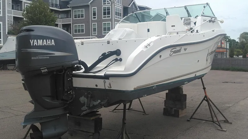 Slide: The Image of 2005 Seaswirl Striper 2301 Dual Console O/B with Yamaha outboard engine on stands. - 4