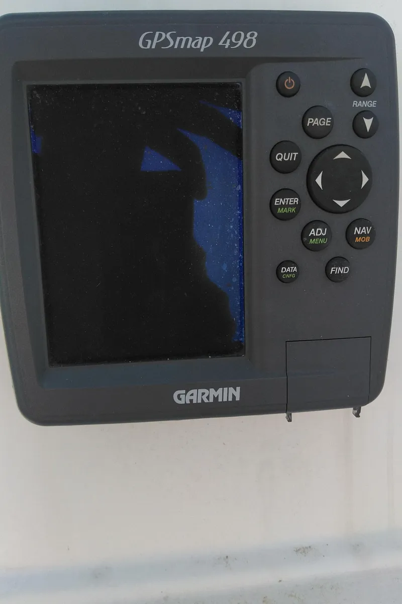 Slide: The Image of Garmin GPSmap 498 on 2005 Seaswirl Striper 2301 Dual Console boat dashboard. - 6