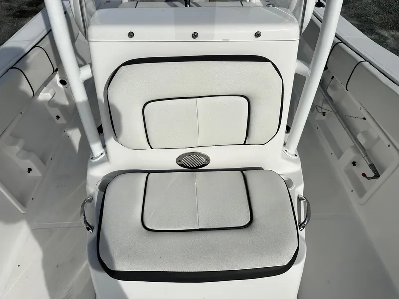 Slide: The Image of 2022 Clearwater 2000CC boat interior with cushioned seating and sleek design. - 10