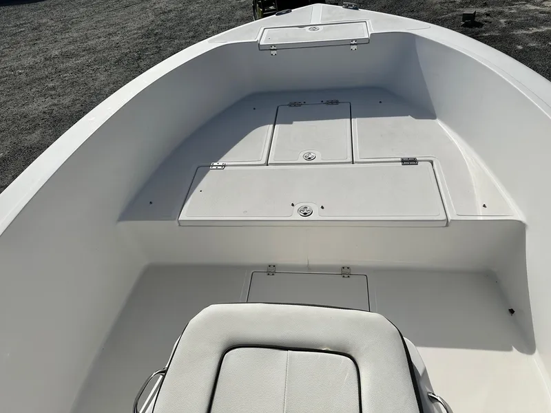 Slide: The Image of 2022 Clearwater 2000CC boat interior with storage compartments and seating. - 11