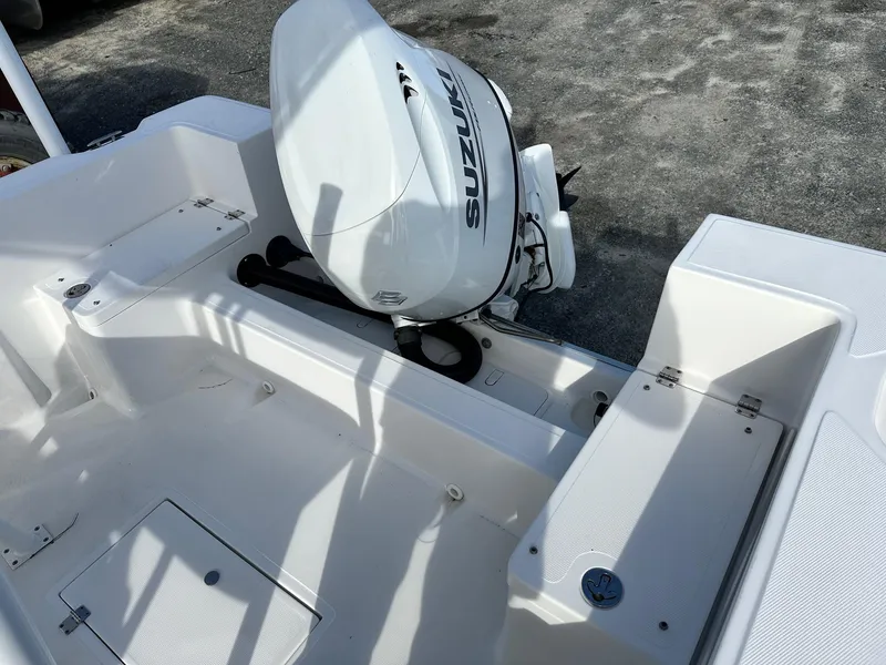 Slide: The Image of Clearwater 2000CC boat with Suzuki outboard motor, 2022 model, white interior. - 12