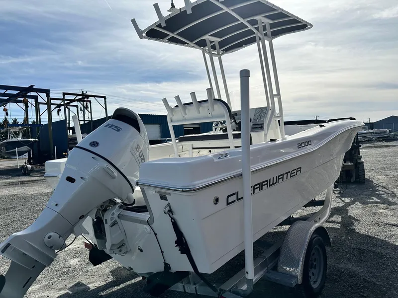 Slide: The Image of 2022 Clearwater 2000CC boat on trailer, featuring a powerful outboard motor. - 5