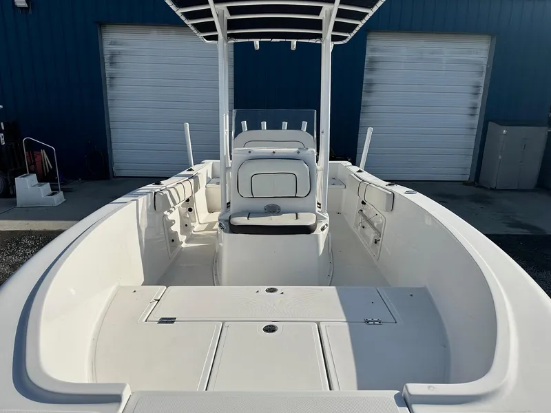 Slide: The Image of 2022 Clearwater 2000CC boat interior with seating and storage compartments. - 7