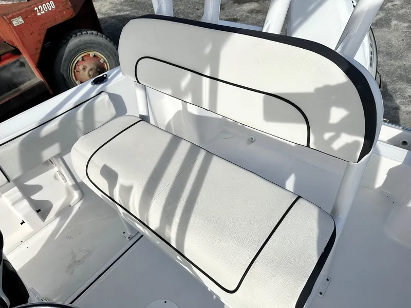 Slide: The Image of White seating on a 2022 Clearwater 2000CC boat, featuring black trim accents. - 9