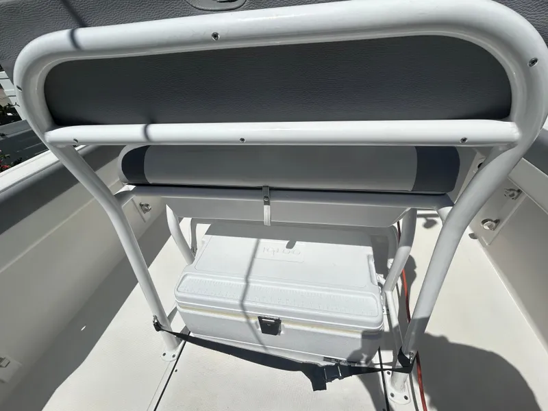 Slide: The Image of 2023 Release 210 RX boat interior with seating and storage compartment. - 24