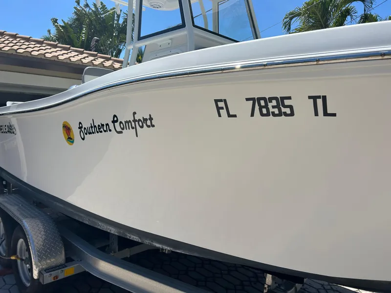 Slide: The Image of 2023 Release 210 RX boat on trailer, named "Southern Comfort," with registration FL 7835 TL. - 3