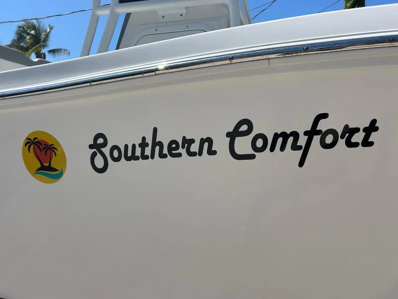Slide: The Image of "Southern Comfort" boat name on 2023 Release 210 RX, featuring tropical logo. - 4