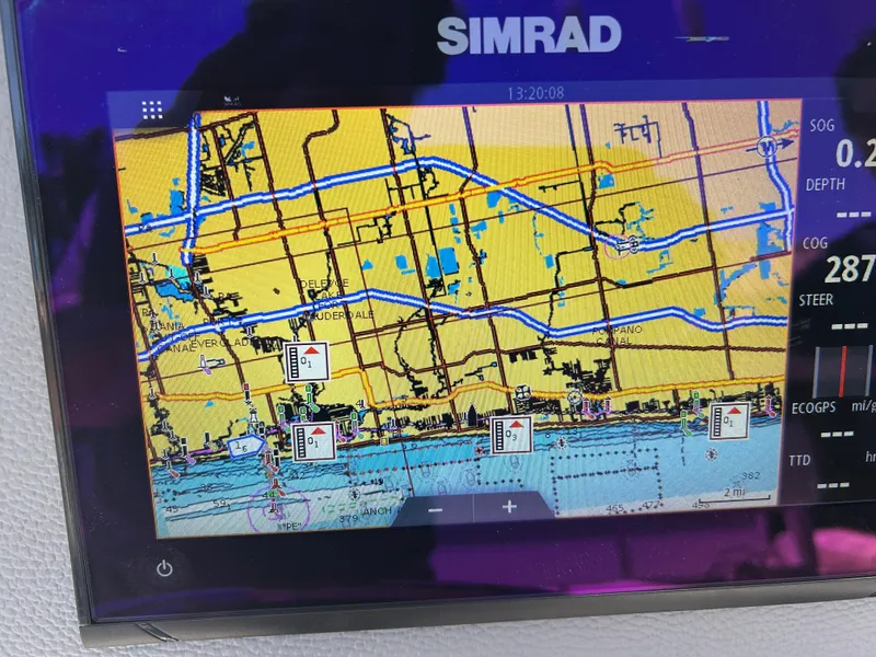 Slide: The Image of Simrad marine GPS display showing nautical chart on Release 210 RX, 2023 model. - 48