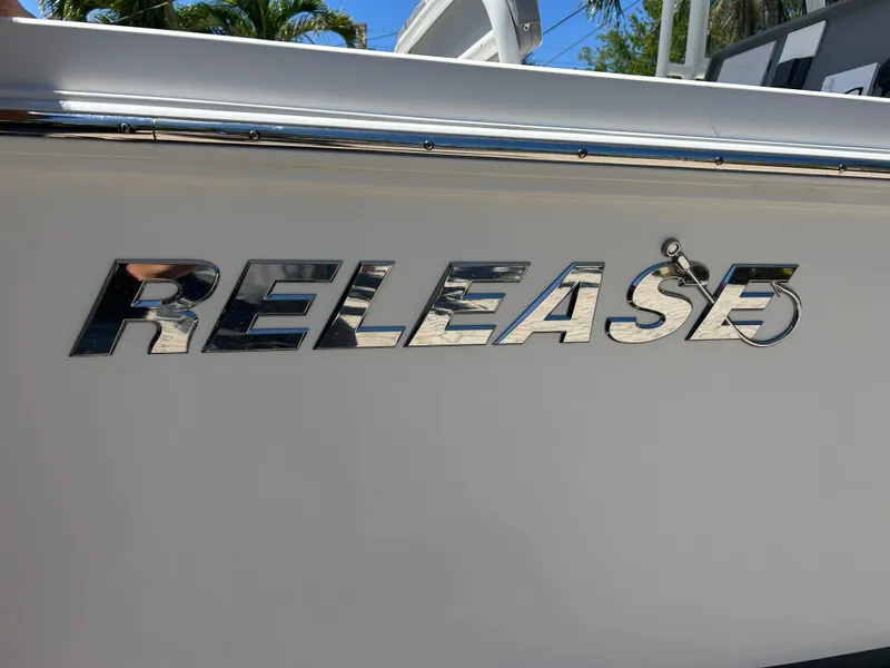 Slide: The Image of 2023 Release 210 RX boat logo on white hull, chrome lettering. - 5