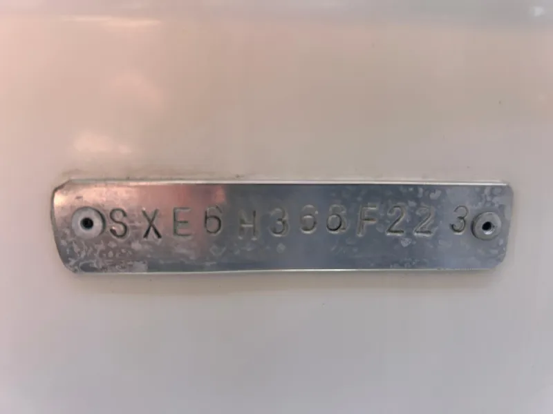 Slide: The Image of Metal identification plate on a 2023 Release 210 RX boat. - 6