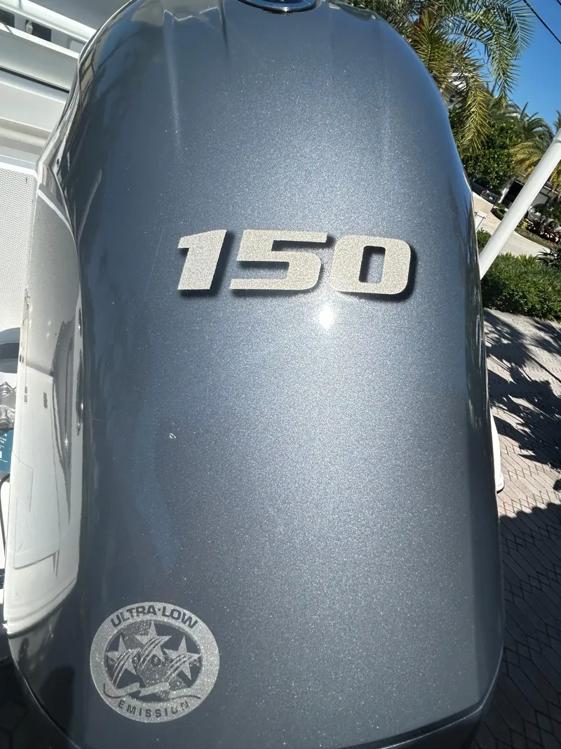Slide: The Image of Outboard motor with "150" label on a 2023 Release 210 RX boat. - 8