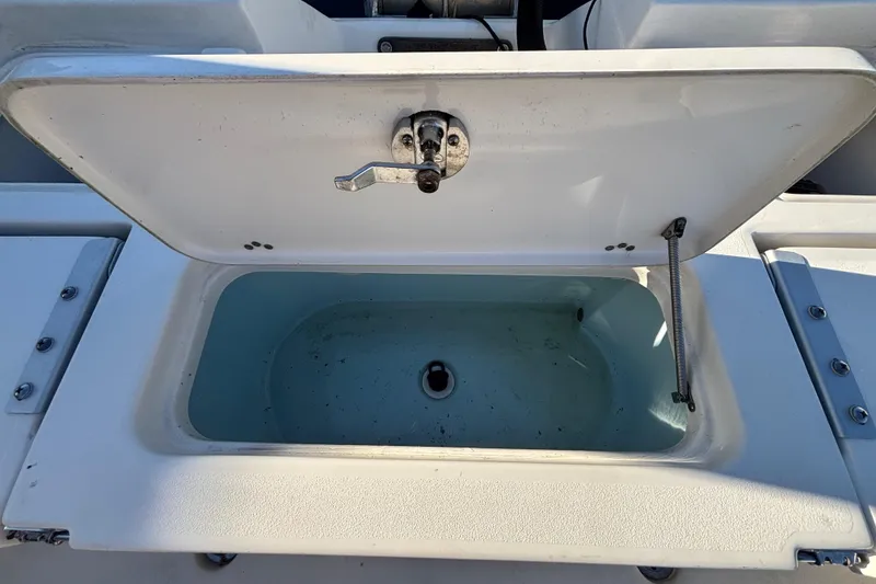 Slide: The Image of Open storage compartment on 2017 Key West 230 Bay Reef boat. - 19