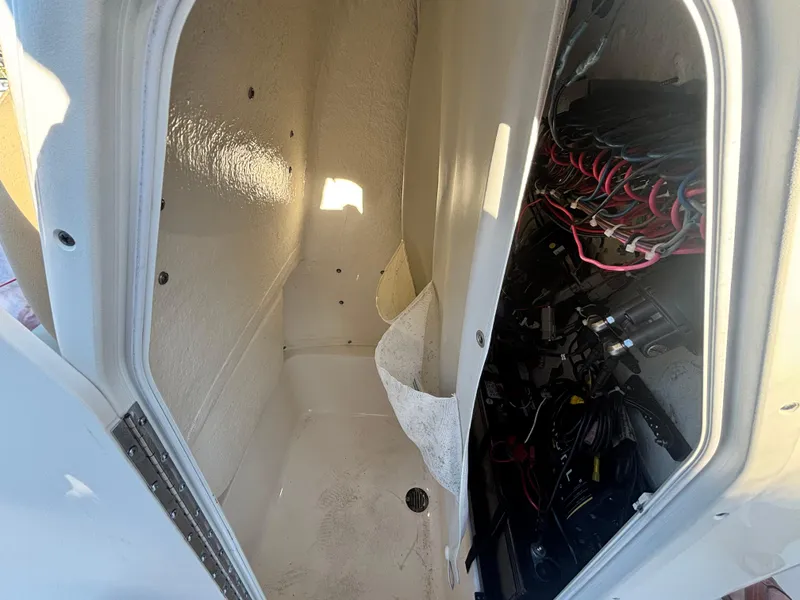 Slide: The Image of Interior view of a 2017 Key West 230 Bay Reef boat compartment with wiring. - 8