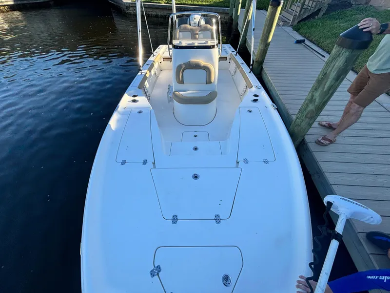 Slide: The Image of 2017 Key West 230 Bay Reef boat docked by wooden pier. - 9