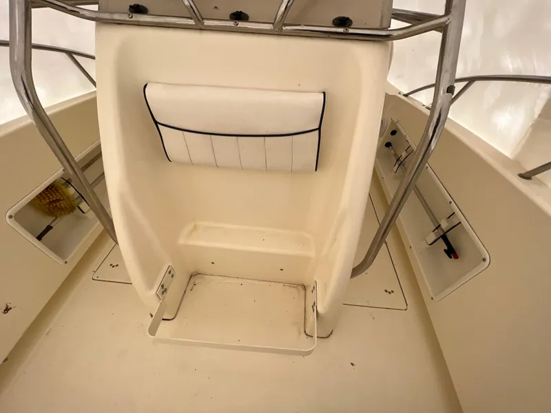 Slide: The Image of 1998 World Cat 270TE boat interior with storage compartments and seating. - 12