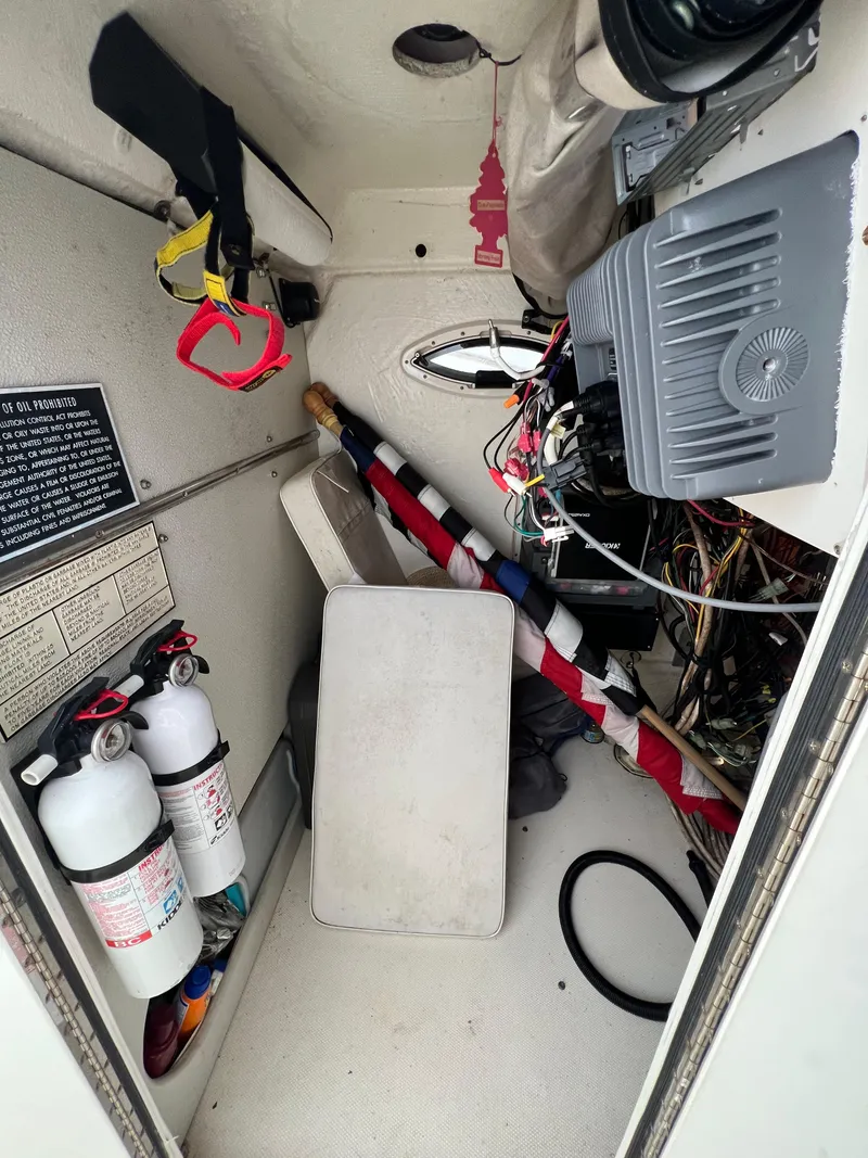 Slide: The Image of Interior of a 1998 World Cat 270TE boat with equipment and wiring. - 17