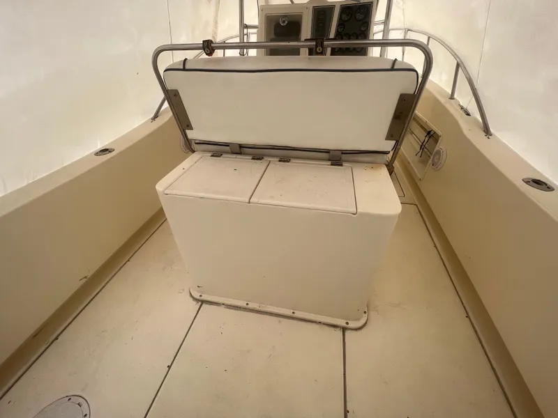 Slide: The Image of 1998 World Cat 270TE boat interior with seating and control panel. - 29