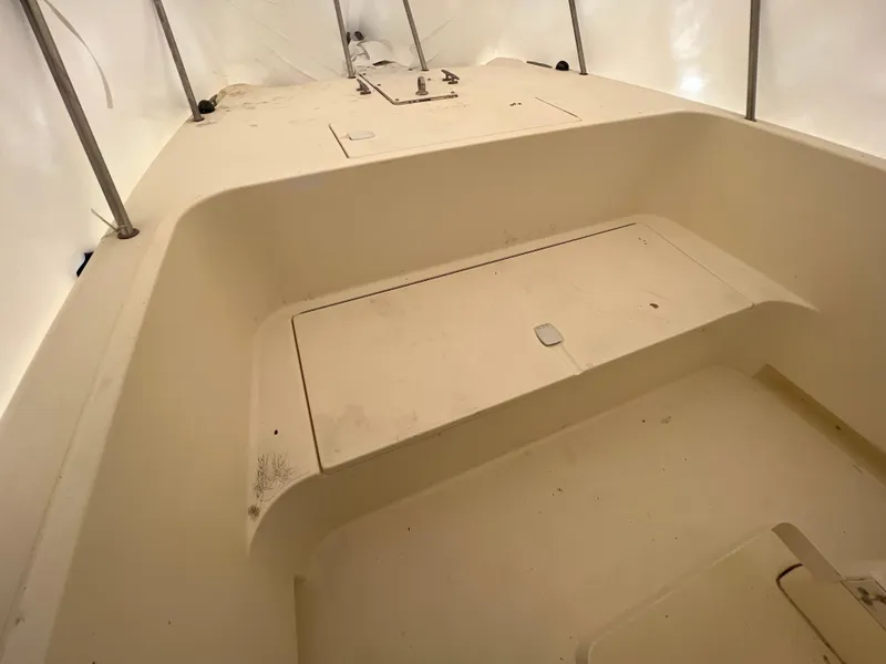 Slide: The Image of 1998 World Cat 270TE boat interior, featuring spacious storage compartments and clean design. - 9