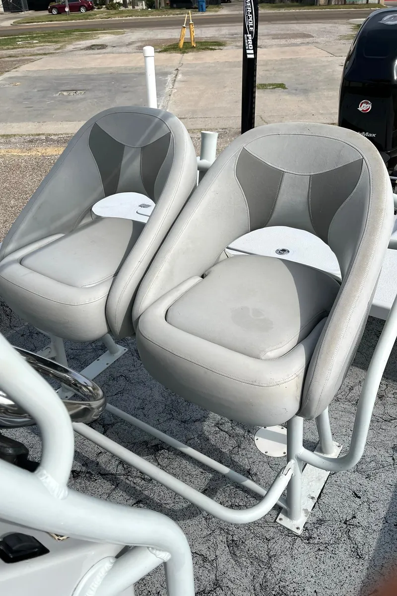 Slide: The Image of 2018 Majek 25 Extreme boat seats, gray upholstery, outdoor setting. - 11