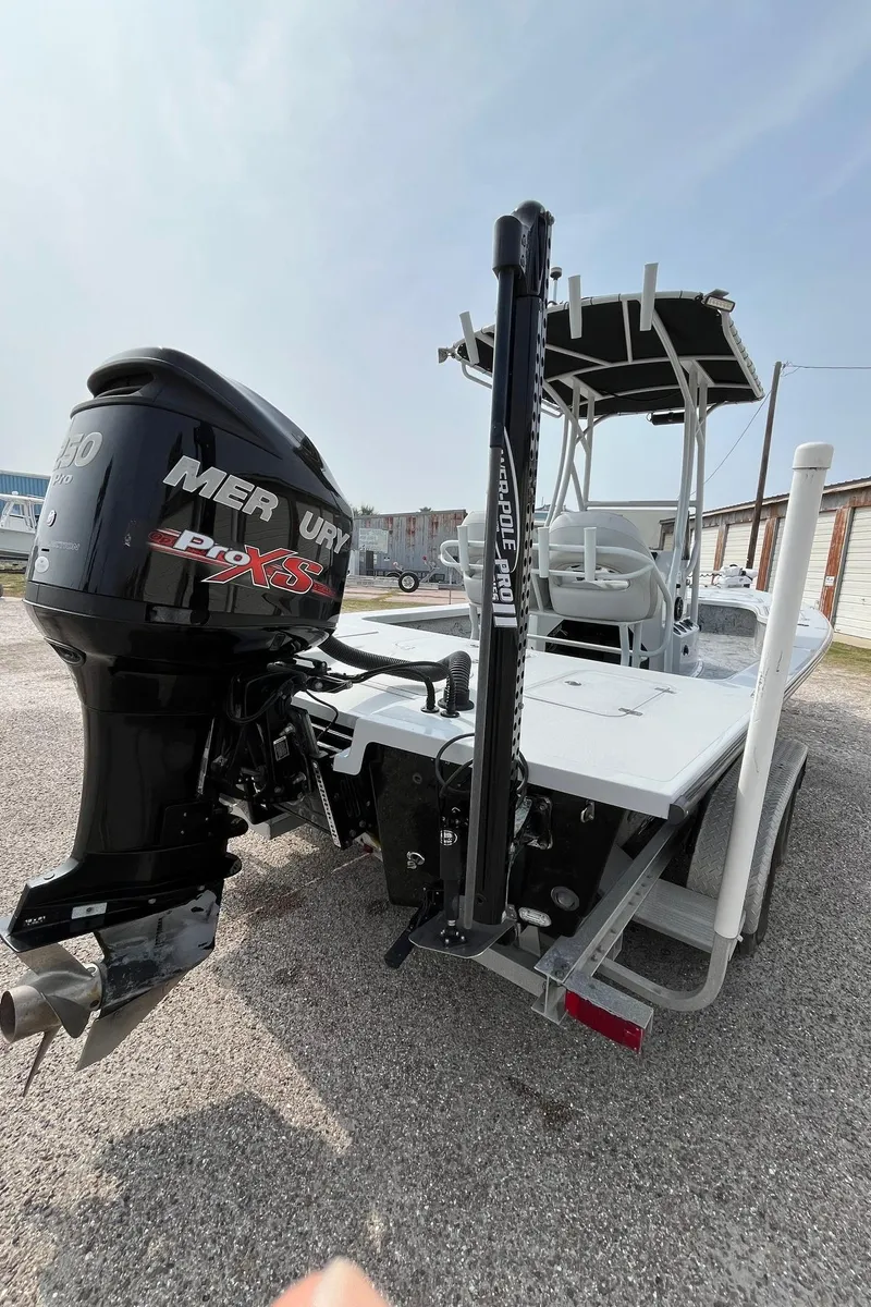 Slide: The Image of 2018 Majek 25 Extreme boat with Mercury engine, parked on gravel. - 13