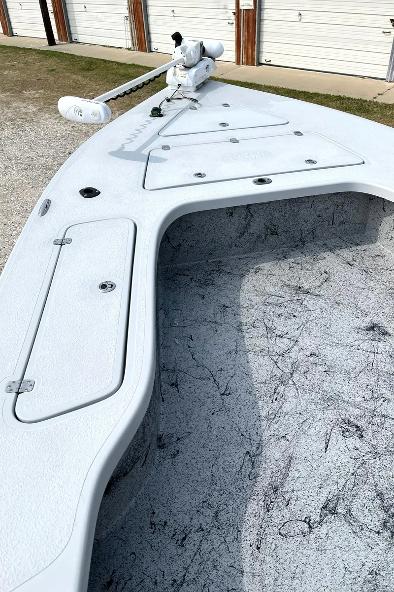 Slide: The Image of 2018 Majek 25 Extreme boat deck with storage compartments and trolling motor. - 5